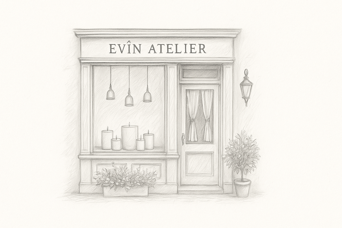 Hand-poured scented candles by Evîn, made from coconut and apricot wax, lined up in plain glass jars